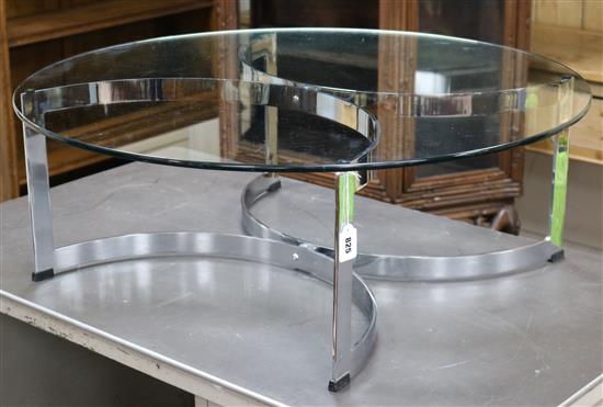 A 1970s Merrow Associates circular glass and chrome based coffee table, designed by Richard Young W.91cm